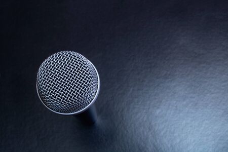 Microphone on black background top view close up, copy spaceの写真素材