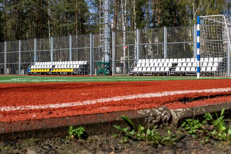 Soccer field with green grass and a treadmill close upの写真素材