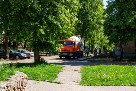 BELARUS, NOVOPOLOTSK - APRIL 29, 2020: Road works in the spring yardのeditorial素材