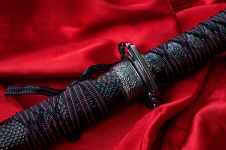 Samurai sword on the red cloth close upの写真素材