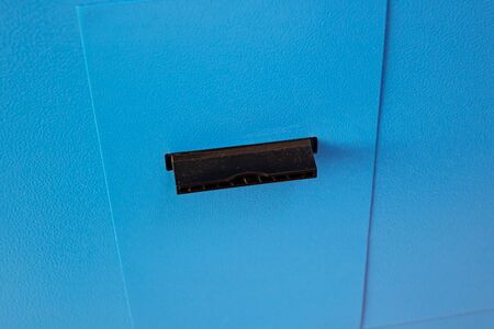 Blue self-service machine and check issuance close up