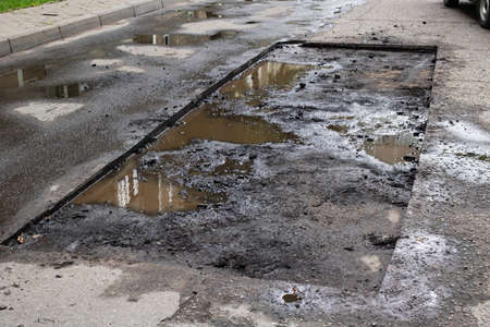 Hole on the pavement on the road during repairs