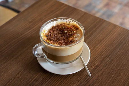 Large glass mug with coffee with milkの写真素材