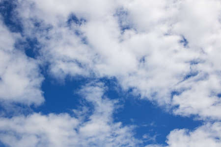 Lush white clouds in the blue sky, background