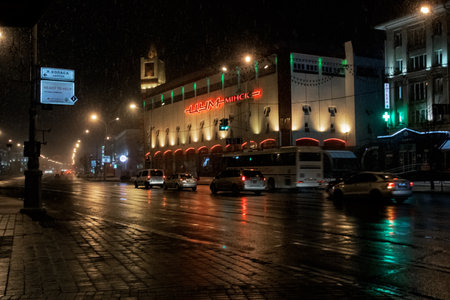 BELARUS, MINSK - JULY 20, 2020: Buildings on Yakub Kolas Square in the evening in the rainのeditorial素材