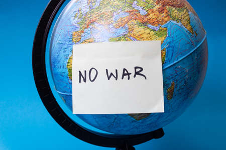 Globe and sticker with the inscription no warの写真素材