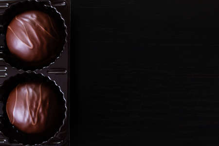 Chocolate candies in a box close up, copy spaceの写真素材