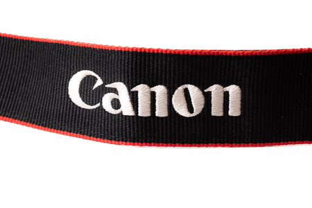 BELARUS, NOVOPOLOTSK - AUGUST 25, 2020: Canon lettering camera strap close up