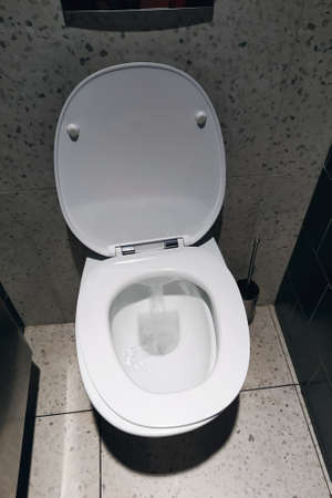 White toilet bowl in restroom top view close upの写真素材