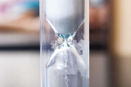 Hourglass with shadow close up, macro photography