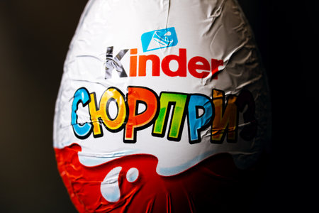 BELARUS, NOVOPOLOTSK - SEPTEMBER 29, 2020: Chocolate egg kinder surprise on black background close upのeditorial素材