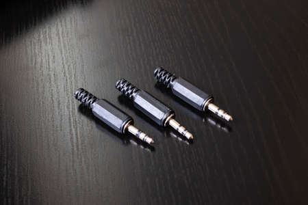 Three plugs for repair on a wooden table