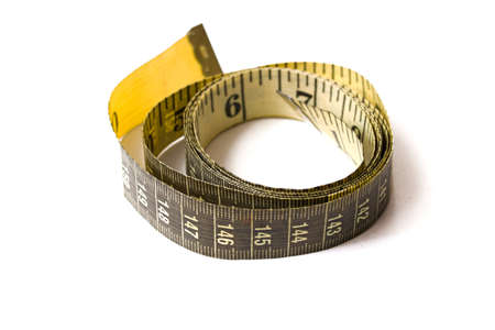 Yellow measuring tape isolated on a white background