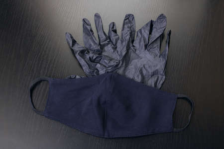 Black gloves and a medical mask close upの写真素材