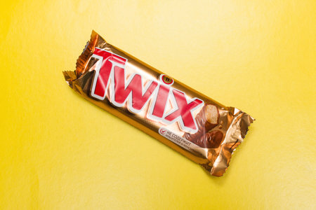 BELARUS, NOVOPOLOTSK - 12 NOVEMBER, 2020: Twix bar on yellow backgroundのeditorial素材