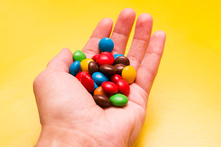 BELARUS, NOVOPOLOTSK - 26 NOVEMBER, 2020: Candy MM's in hand close upのeditorial素材