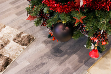 Toys on a Christmas tree on a wooden floor backgroundの写真素材