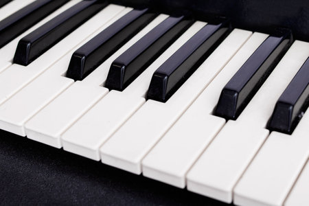 White and black piano keys close upの写真素材