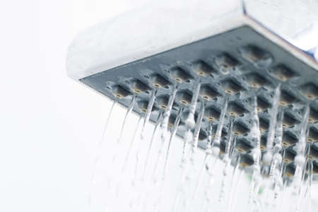 Jets of water from the shower head close up