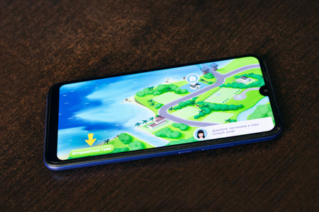 NOVOPOLOTSK, BELARUS - 06 FEBRUARY, 2021: Phone in hand and game Sims on displayのeditorial素材