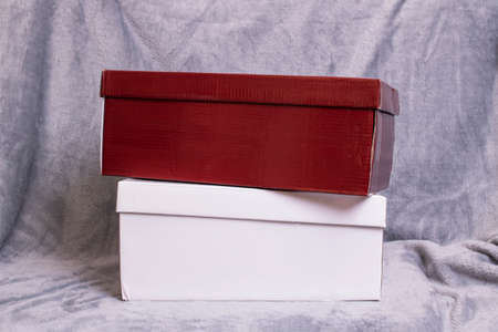 Two cardboard boxes on a gray background close up