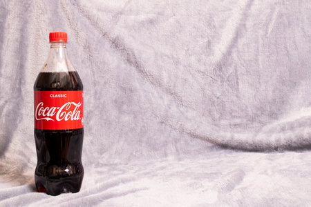 BELARUS, NOVOPOLOTSK - 20 FEBRUARY, 2021: Coca-cola bottle on gray background, copy spaceのeditorial素材