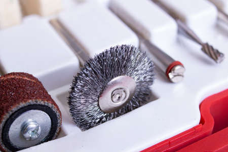Sander attachments in a white container close up