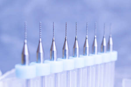 Dental drill attachment set on gray background close up