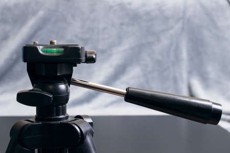 Tripod head close up on a gray backgroundの写真素材