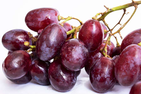 Bunch of red grapes on white background close upの写真素材