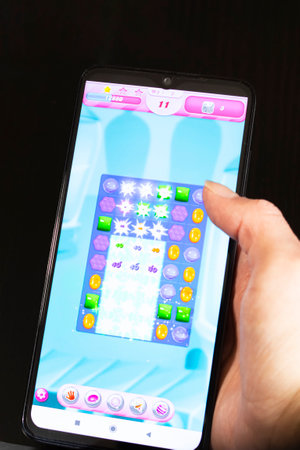 BELARUS, NOVOPOLOTSK - 27 MARCH, 2021: Candy crush game on phone display close upのeditorial素材