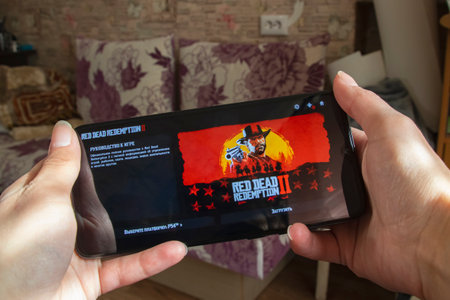BELARUS, NOVOPOLOTSK - 27 MARCH, 2021: Red dead redemption game on phone display close up