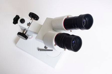 Gray medical microscope on a white background top view