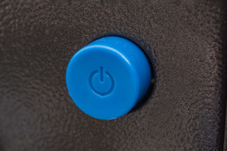 Blue power button on an electronic device