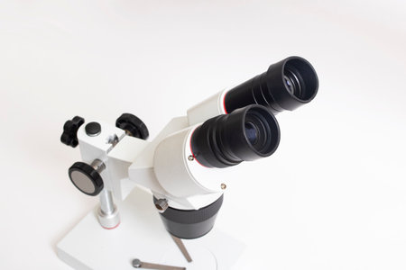 Gray medical microscope on a white background top viewの写真素材