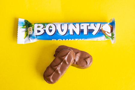 BELARUS, NOVOPOLOTSK - 12 APRIL, 2021: Bounty bar on yellow background close upのeditorial素材