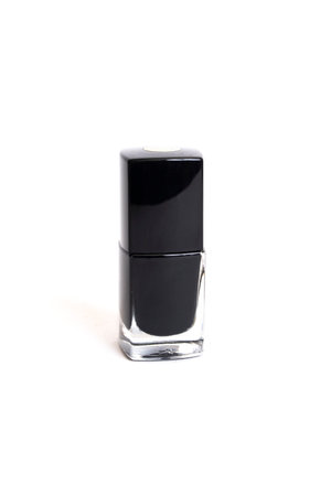 Black nail polish and brush isolated on white background close upの写真素材