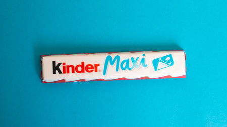 BELARUS, NOVOPOLOTSK - 11 MAY, 2021: Kinder maxi on blue background close up