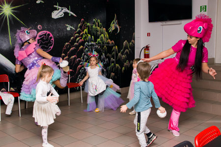 BELARUS, NOVOPOLOTSK - 29 DECEMBER, 2021: Children play a competition with animators close upのeditorial素材