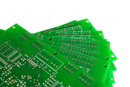 Heap of green printed circuit boards isolated on white background close up