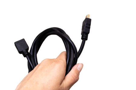 Black computer wire in hand isolated on white background close upの写真素材