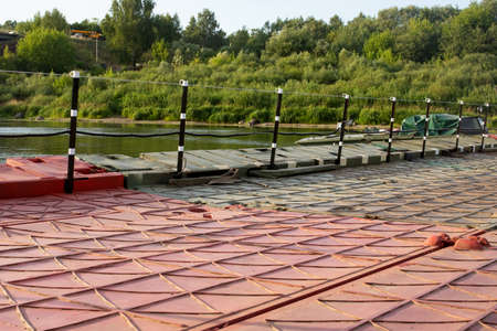Fencing on the dock by the river close upの写真素材