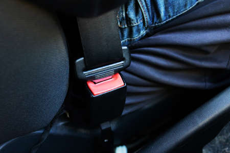 Fastened seat belt in the car close up