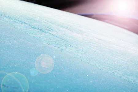 Ice bloom on the blue surface of the carの写真素材