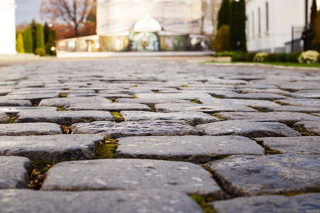 Cobblestone paving from gray stones close up, background or textureの写真素材