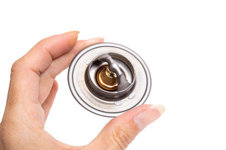 Thermostat for car in hand isolated on white backgroundclose up