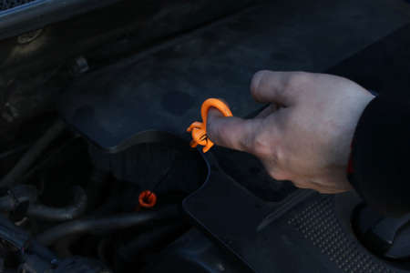 Checking the oil level in the car