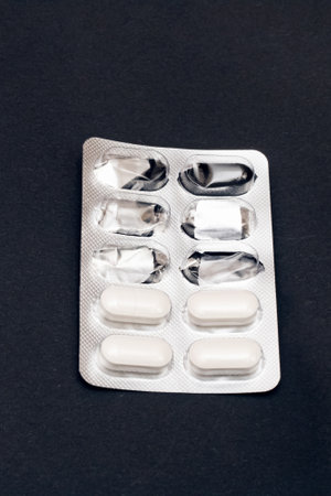 Packing pills on a gray background close up, copy spaceの写真素材