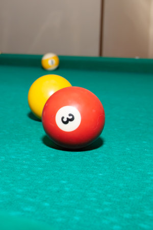 Billiard balls on a green table close upの写真素材