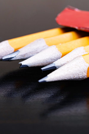 Simple pencils in box on wooden tableの写真素材